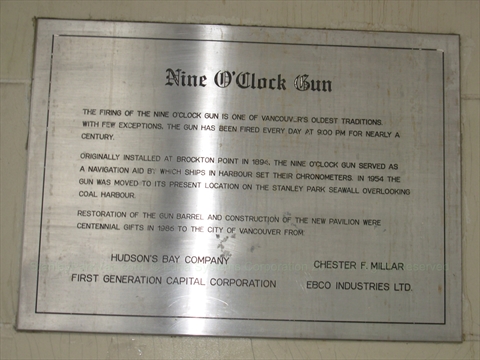 Nine O'Clock Gun plaque on Bay store on Granville Street, Vancouver, BC, Canada
